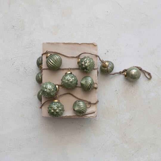 Hello Honey® 6ft. Olive Green Embossed Mercury Glass Ball Ornament Garland